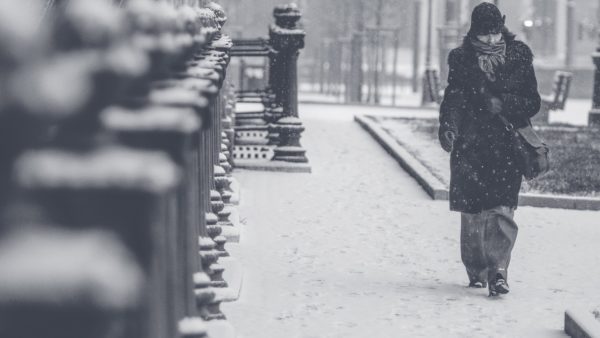 Woman walking in cold, snowy weather